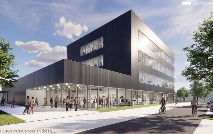 Vorschau auf das Gebäude, ein moderner, anthrazitfarbener Bau mit Glaselementen